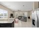 Bright and spacious living area boasting tile floors, a ceiling fan, and lake views at 2916 Meleto Blvd, New Smyrna Beach, FL 32168