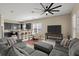 Inviting living space with tile flooring, a ceiling fan, and an open layout with kitchen view at 2916 Meleto Blvd, New Smyrna Beach, FL 32168