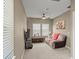 Comfortable living room with a ceiling fan, entertainment center, and recliner sofa at 2916 Meleto Blvd, New Smyrna Beach, FL 32168