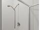 Shower head and faucet against white tile in modern-style bathroom at 2916 Meleto Blvd, New Smyrna Beach, FL 32168
