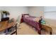 Bedroom featuring a wooden bed, desk with chair, and a window with natural light at 2919 Sime St, New Smyrna Beach, FL 32168