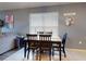Dining room featuring a wood table with four chairs, natural light from a window, and neutral wall colors for a cozy atmosphere at 2919 Sime St, New Smyrna Beach, FL 32168