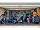 Organized two-car garage with ample storage space and home gym equipment at 2919 Sime St, New Smyrna Beach, FL 32168
