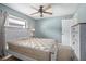 Neutral bedroom with a ceiling fan, ample natural light, and light-colored furniture at 2980 Lockwood Blvd, Deltona, FL 32738