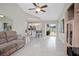 Bright open-concept living room with tile flooring and slider access to pool area at 2980 Lockwood Blvd, Deltona, FL 32738