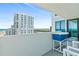Enjoy expansive city and ocean views from this condo balcony with comfortable seating and serving station at 2987 S Atlantic # 1403, Daytona Beach Shores, FL 32118
