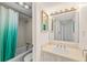 Functional bathroom with tub, shower, and vanity with ample lighting at 2987 S Atlantic # 1403, Daytona Beach Shores, FL 32118