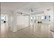 Open living room featuring tile flooring, mirrored wall, and an ocean view at 2987 S Atlantic # 1403, Daytona Beach Shores, FL 32118