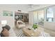 Open living room featuring tile flooring, ocean views, and comfortable seating at 2987 S Atlantic # 1403, Daytona Beach Shores, FL 32118