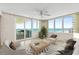 Bright living room featuring tile flooring, ceiling fan, and ocean views at 2987 S Atlantic # 1403, Daytona Beach Shores, FL 32118