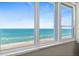 Close up of the window with views of the Atlantic ocean and shoreline at 2987 S Atlantic # 1403, Daytona Beach Shores, FL 32118