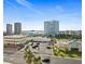 Wide aerial shot of commercial buildings, a parking lot, and a distant ocean at 2987 S Atlantic # 606, Daytona Beach Shores, FL 32118