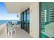 Balcony with outdoor seating overlooking the ocean with sliding glass doors at 2987 S Atlantic # 606, Daytona Beach Shores, FL 32118