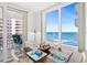 Bright dining area featuring ocean views and access to the balcony, perfect for enjoying meals at 2987 S Atlantic # 606, Daytona Beach Shores, FL 32118