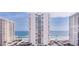 Exterior shot of tall condo buildings next to the beach on a beautiful sunny day at 2987 S Atlantic # 606, Daytona Beach Shores, FL 32118