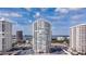 Exterior view of the high-rise condo building on a sunny day, with views of the coastline and surrounding buildings at 2987 S Atlantic # 606, Daytona Beach Shores, FL 32118