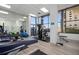 Well-equipped fitness center with modern exercise machines and floor to ceiling windows at 2987 S Atlantic # 606, Daytona Beach Shores, FL 32118