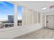Hallway with a large window, city views and condo doors at 2987 S Atlantic # 606, Daytona Beach Shores, FL 32118