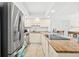 Updated kitchen boasts stainless steel refrigerator and granite countertops at 2987 S Atlantic # 606, Daytona Beach Shores, FL 32118