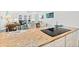 Open concept kitchen with a smooth cooktop and views into the living area at 2987 S Atlantic # 606, Daytona Beach Shores, FL 32118