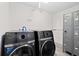 Community laundry area with modern front loading washer and dryers at 2987 S Atlantic # 606, Daytona Beach Shores, FL 32118