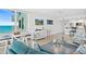 Bright living room features stylish coastal decor and dining area with ocean view at 2987 S Atlantic # 606, Daytona Beach Shores, FL 32118