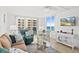 Cozy living room featuring comfortable seating, stylish decor and access to a balcony at 2987 S Atlantic # 606, Daytona Beach Shores, FL 32118