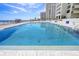 Outdoor swimming pool with clear blue water and plenty of space for lounging in the sun at 2987 S Atlantic # 606, Daytona Beach Shores, FL 32118