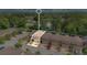 Aerial view of townhome featuring garages, driveways, and convenient parking at 302 Tammie Sue Ln, Deland, FL 32724