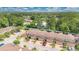Scenic aerial view of townhomes offering garages, brick driveways, and scenic views at 302 Tammie Sue Ln, Deland, FL 32724