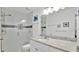 Modern bathroom featuring sleek fixtures, a glass-enclosed shower and marble countertop at 302 Tammie Sue Ln, Deland, FL 32724