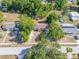 Aerial shot capturing the home and its neighborhood setting, complete with mature trees at 31 Lake Dr, Debary, FL 32713