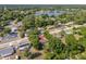 Scenic aerial view of a home and surrounding neighborhood, with a lake visible in the background at 31 Lake Dr, Debary, FL 32713