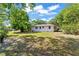 Expansive backyard showcasing a spacious grassy area, perfect for outdoor activities and relaxation at 31 Lake Dr, Debary, FL 32713