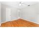 Bedroom featuring hardwood floors, a ceiling fan, and closet at 31 Lake Dr, Debary, FL 32713