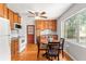 Bright kitchen with hardwood floors and wood cabinets, featuring a ceiling fan at 31 Lake Dr, Debary, FL 32713