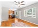 Open living room with hardwood floors, a neutral color palette, and windows offering natural light at 31 Lake Dr, Debary, FL 32713