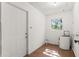 Utility room with water heater and door at 31 Lake Dr, Debary, FL 32713