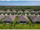 Neighborhood aerial view showcasing the homes and lush green lawns at 3148 Bailey Ann Dr, Ormond Beach, FL 32174
