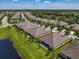 Scenic aerial view of the homes in a neighborhood next to a lake at 3148 Bailey Ann Dr, Ormond Beach, FL 32174