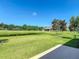 Expansive backyard with lush green lawn and serene pond view, perfect for outdoor enjoyment at 3148 Bailey Ann Dr, Ormond Beach, FL 32174
