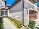 Detailed view of the exterior showcasing the home's architecture and landscaped walkway at 3148 Bailey Ann Dr, Ormond Beach, FL 32174