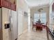 Bright kitchen with stainless steel refrigerator and adjacent dining area at 3148 Bailey Ann Dr, Ormond Beach, FL 32174