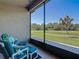 Relaxing screened lanai with comfortable seating and a beautiful view of the pond at 3148 Bailey Ann Dr, Ormond Beach, FL 32174