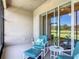 Cozy screened lanai with seating area, plant decor, and sliding glass doors to the home at 3148 Bailey Ann Dr, Ormond Beach, FL 32174