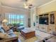 Living room with large sliding doors and a view to a green outdoor space at 3148 Bailey Ann Dr, Ormond Beach, FL 32174