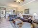 Living room with comfortable furniture and a view into the kitchen at 3148 Bailey Ann Dr, Ormond Beach, FL 32174