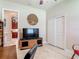 Bright office space with neutral tones, closet, entertainment center and access to an adjacent room at 3148 Bailey Ann Dr, Ormond Beach, FL 32174