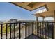 Balcony view looking out onto a coastal community with mature palm trees at 3170 Ocean Shore Blvd # 5010, Ormond Beach, FL 32176