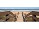 Wooden walkway providing access to the beach and ocean at 3170 Ocean Shore Blvd # 5010, Ormond Beach, FL 32176